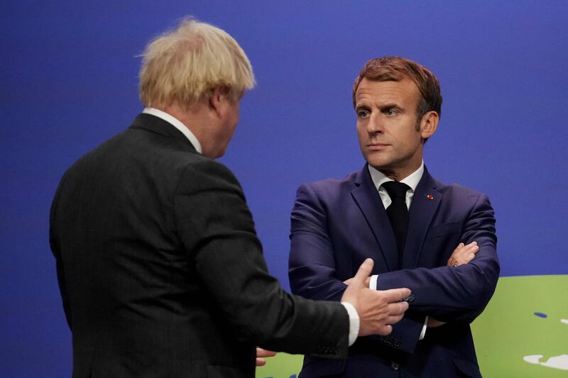 Britain's Prime Minister Boris Johnson and French President Emmanuel Macron at the Cop26 summit earlier this month. AFP