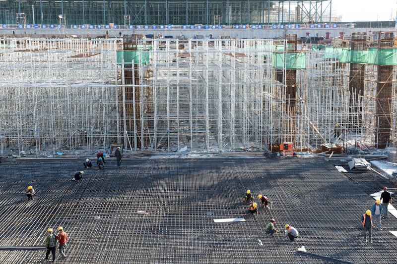 Workers are seen at the construction site of Zhangjiakou South railway station in Hebei province, China October 7, 2018. Picture taken October 7, 2018. REUTERS/Stringer ATTENTION EDITORS - THIS IMAGE WAS PROVIDED BY A THIRD PARTY. CHINA OUT.