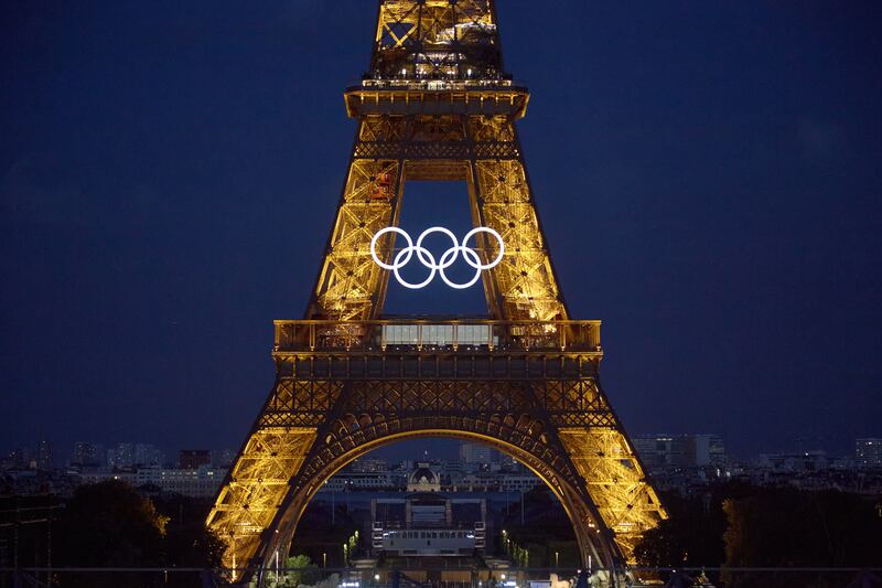 The Olympic rings are seen on the Eiffel Tower in Paris. Getty Images