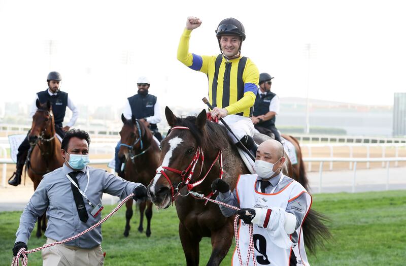 Christophe Lemaire celebrates after guiding Stay Foolish to victory in the Dubai Gold Cup at Meydan Racecourse. Pawan Singh / The National