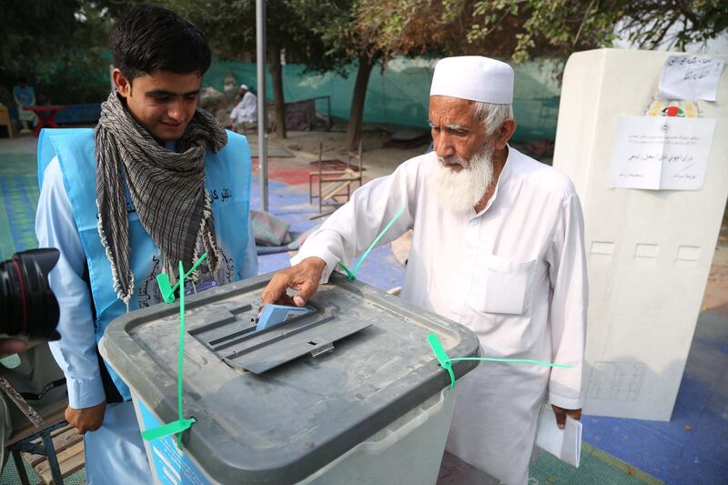 An Afghan man casts his ballot during the presidential elections, in Jalalabad, Afghanistan.  EPA