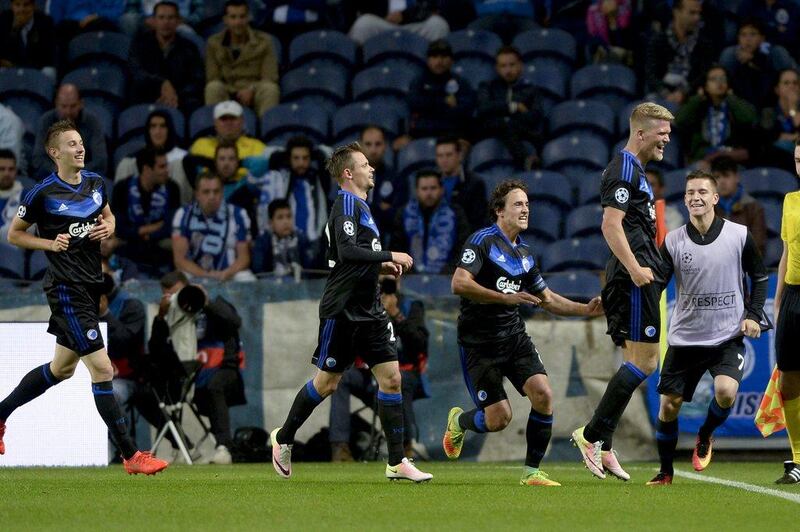 FC Copenhagen striker Andreas Cornelius, right, celebrates after scoring the equalising goal against FC Porto. The match ended 1-1. Fernando Veludo / EPA