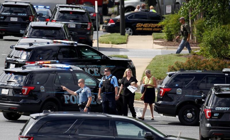 Police officers secure the crime scene. Joshua Roberts / Reuters