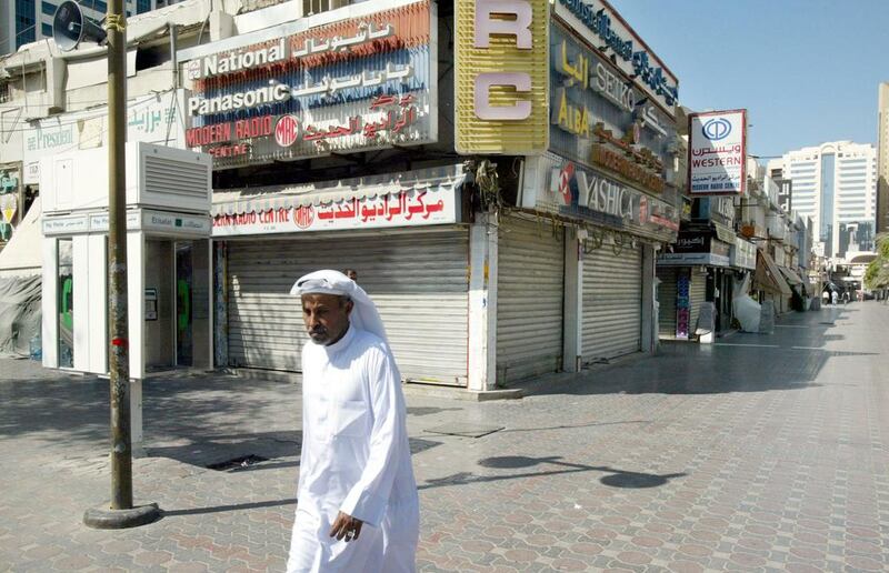 An Emirati walks through deserted street in Abu Dhabi following the death of Sheikh Zayed. Reuters