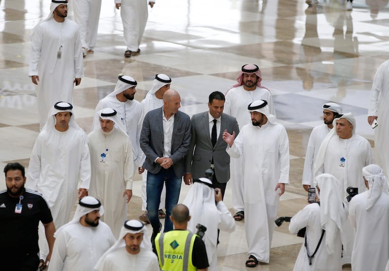 Sheikh Ahmed bin Mohammed , Chairman of the Mohammed bin Rashid Al Maktoum Knowledge Foundation,  arrives with Real Madrid manager Zinedine Zidane at the DAIS conference. EPA