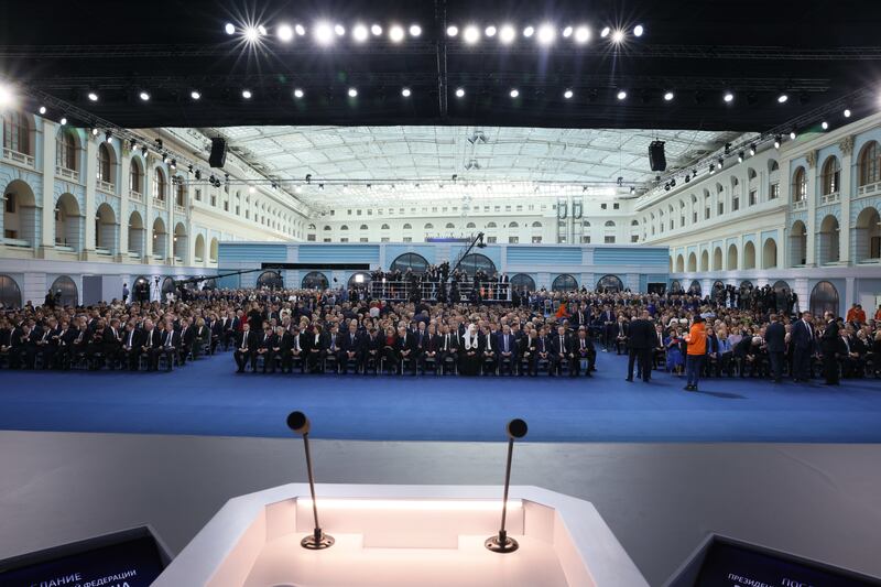 People gather for the state of the nation speech at Gostiny Dvor conference centre in Moscow. EPA