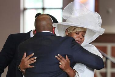 A church pastor comforts Tomika Miller, the wife of Rayshard Brooks, during his public viewing in Atlanta. Atlanta Journal-Constitution via AP