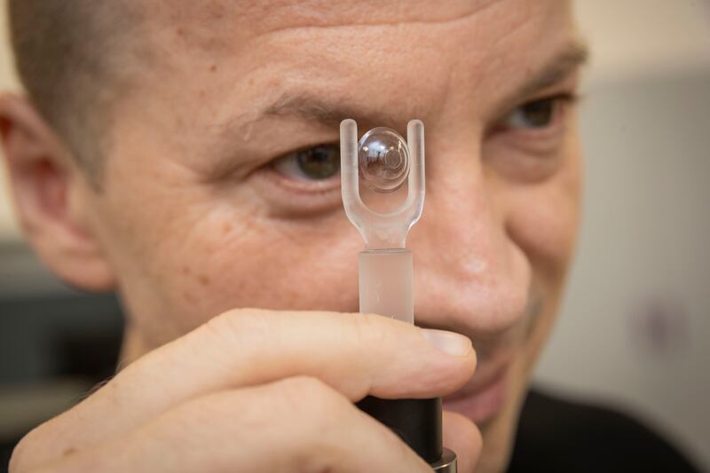 Valentyn Volkov, co-founder and scientific partner at Xpanceo, with a prototype smart contact lens. Antonie Robertson / The National