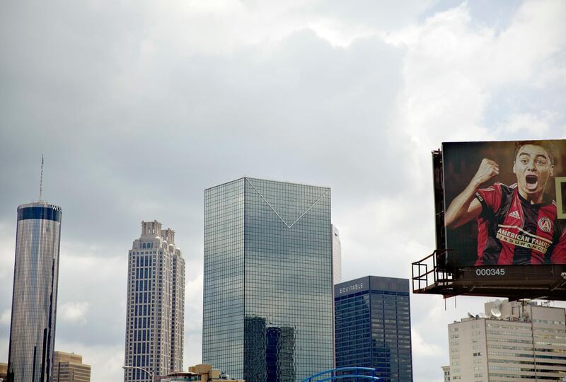 A billboard for Atlanta's MLS soccer team stands against the downtown skyline in Atlanta, Wednesday, June 13, 2018. The 2026 World Cup will return to the U.S. for the first time since 1994. Atlanta's new Mercedes-Benz Stadium was shown prominently in the video used in the North American pitch for the bid. (AP Photo/David Goldman)