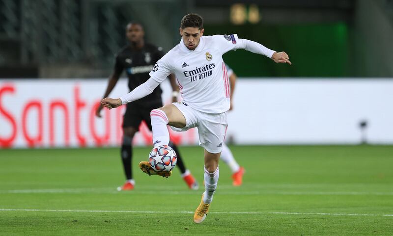MOENCHENGLADBACH, GERMANY - OCTOBER 27: Federico Valverde of Madrid runs with the ball during the UEFA Champions League Group B stage match between Borussia Moenchengladbach and Real Madrid at Borussia-Park on October 27, 2020 in Moenchengladbach, Germany. (Photo by Lars Baron/Getty Images)