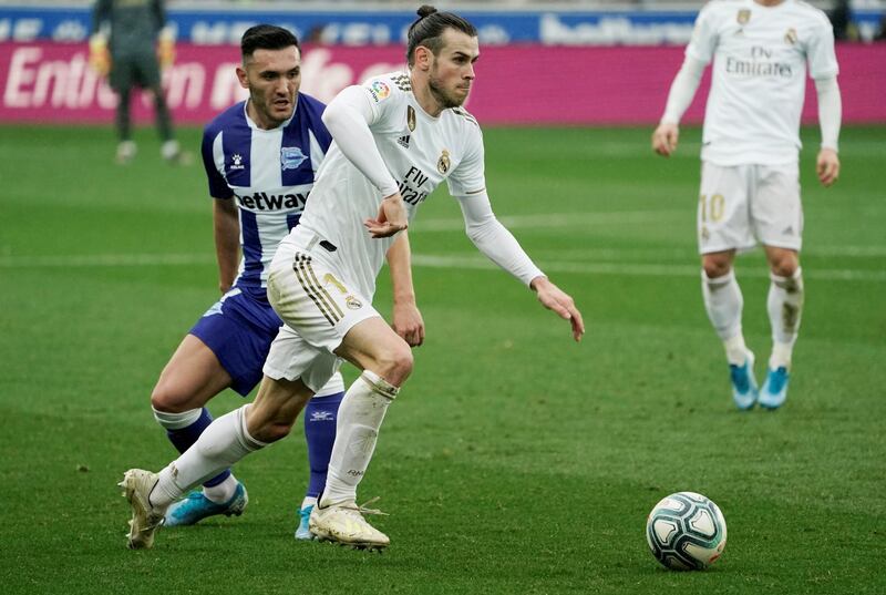Alaves' Lucas Perez in action with Real Madrid's Gareth Bale. Reuters