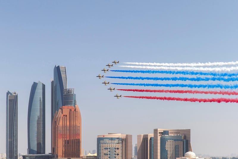 ABU DHABI, UNITED ARAB EMIRATES - October 15, 2019: The Al Forsan aerobatic team perform a flyby during the arrival of HE Vladimir Putin Vladimirovich, President of Russia, commencing a state visit at Qasr Al Watan.( Mohammed Al Blooshi for Ministry of Presidential Affairs )---