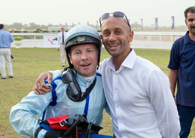 09.11.19. Sharjah. Race 5  Philosopher -Royston Ffrench who had to give up the ride due to injury congratulates  Tadhg O'Shea - Erika Rasmussen