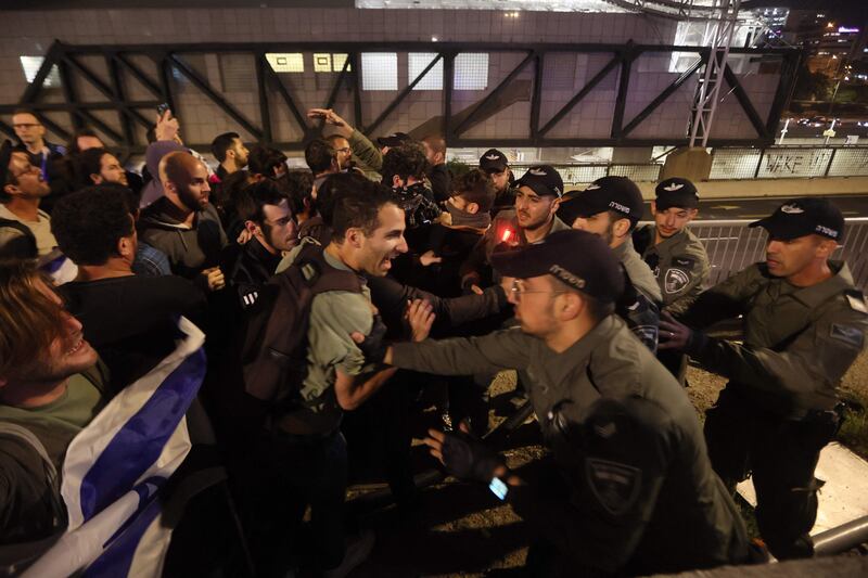 Protesters face off with the police in Tel Aviv. AFP