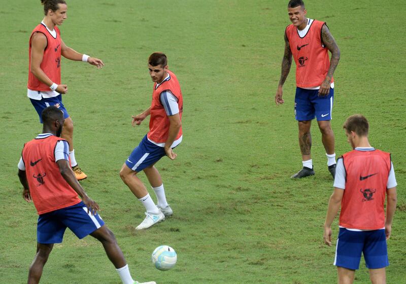 Alvaro Morata, centre, joined up with his new Chelsea teammates on Monday after signing from Real Madrid. Roslan Rahman / AFP