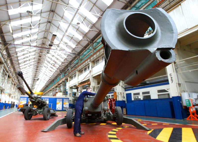 An engineer works on an M777 howitzer at the BAE Systems factory at Barrow-in-Furness in northern England. David Moir / Reuters