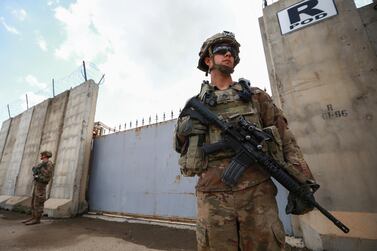 Â US soldier stands guard at the K1 Air Base near Kirkuk in northern Iraq, during a handover ceremony. Getty