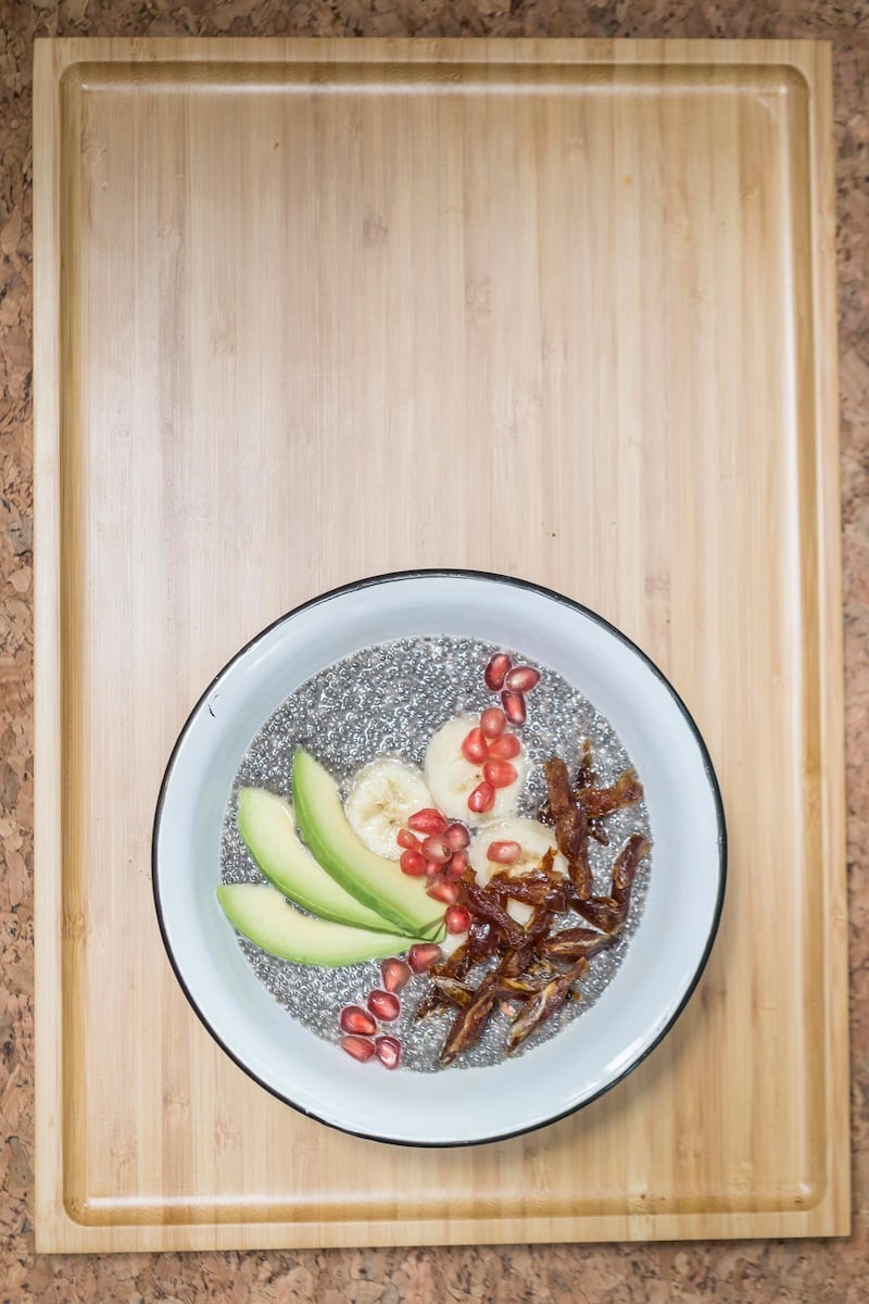 DUBAI, UNITED ARAB EMIRATES, 17 JULY 2016. Wild and the Moon restaurant in Al Serkal Venue. Chia pudding with Almond milk, Banana, Avocado, Dates and Polmegranite. (Photo: Antonie Robertson/The National) ID: 43078. Journalist: Jennifer Bell. Section: National. *** Local Caption ***  AR_1707_AR_1707_Wild_And_The_Moon-05.JPG