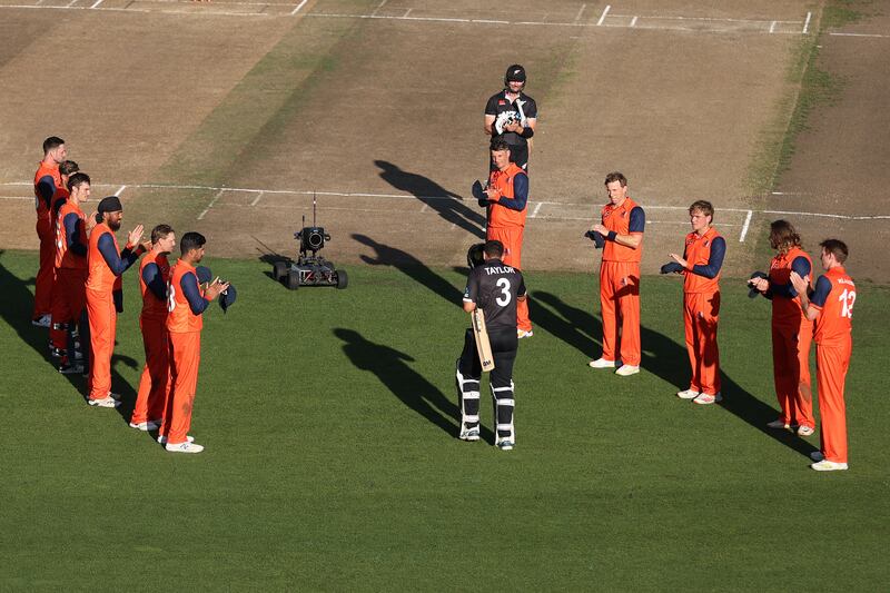 The Netherlands team form a guard of honour as Ross Taylor  walks out to bat in his last game for New Zealand. Getty