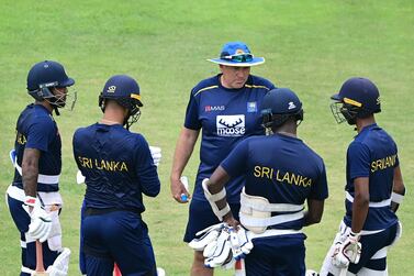Sri Lanka's cricket coach Mickey Arthur (C) speaks to players during a practice session at the Sher-e-Bangla National Cricket Stadium in Dhaka on May 9, 2022, ahead of their first cricket Test match against Bangladesh.  (Photo by Munir uz ZAMAN  /  AFP)