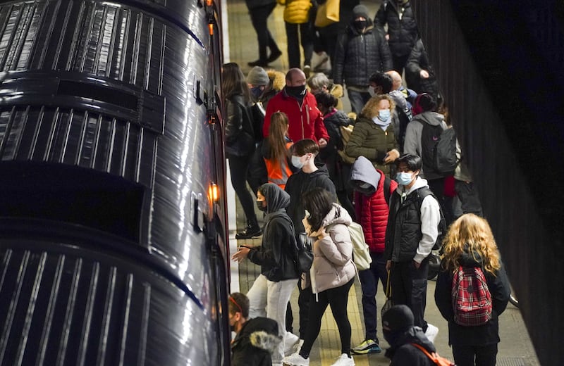 Commuters wait to catch a London-bound train in Bracknell, Berkshire. Workers are returning to offices in the first full working week of 2022 even though guidance under England’s current plan B measures is to work from home. PA