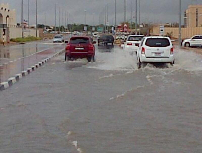 Cars plough through the rain in Al Ain. Michael Jabri-Pickett