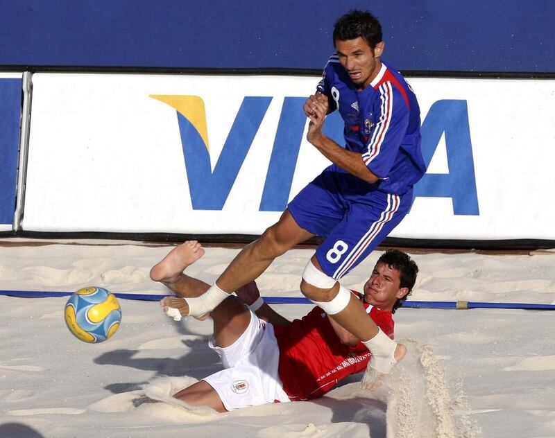 France’s Stephane Francois (8) challenges Uruguay’s Pampero for the ball during their Fifa Beach Soccer World Cup 2008 match in Marseille in 2008. Philippe Laurenson  / Reuters