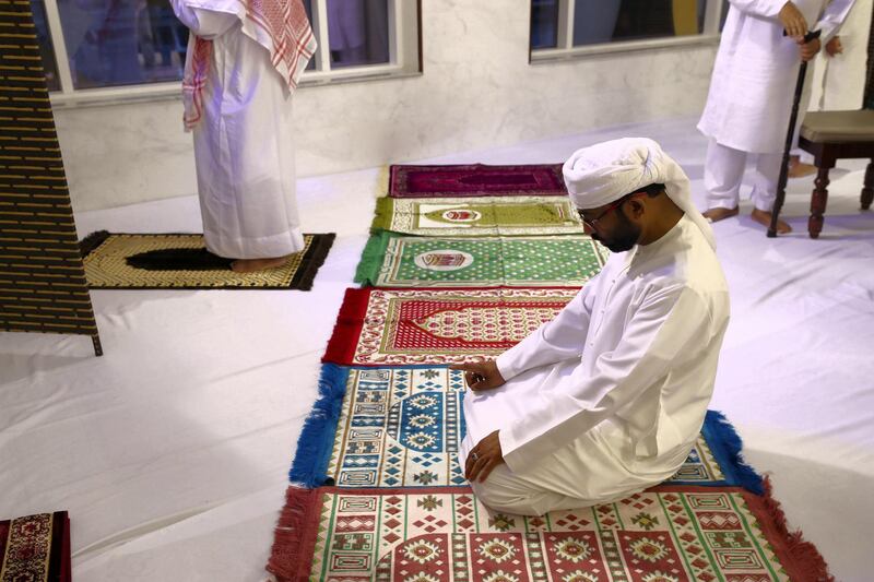 Dubai, United Arab Emirates - May 15, 2019: Prayers are made before Iftar. People take part in a multi faith Iftar at Gurunanak Darbar Sikh Gurudwara. Wednesday the 15th of May 2019. Jebel Ali, Dubai. Chris Whiteoak / The National