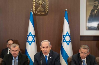 Israeli Prime Minister Benjamin Netanyahu, centre, next to Justice Minister Yariv Levin, left. AFP