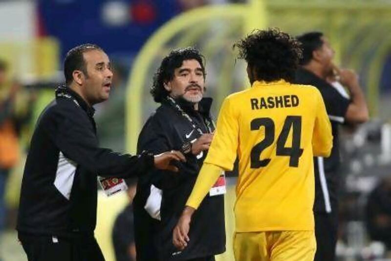 Al Wasl coach Diego Maradona on the touchline with Rashed Essa, one of the goalscorers.