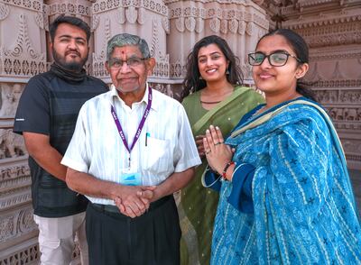 (Left to right) Suraj Parmar, Shashikant Depala, Priyanka Lodhia and Niyanta Patel are among worshippers helping to get Abu Dhabi's first Hindu temple ready to open in February.  Victor Besa / The National