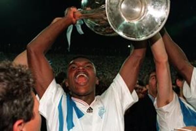Marcel Desailly lifts the European Cup  in 1993 after Marseille beat AC Milan 1-0 in Munich.