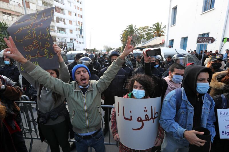 Protesters shout slogans during a demonstration next to the Tunisian parliament in Tunis. EPA