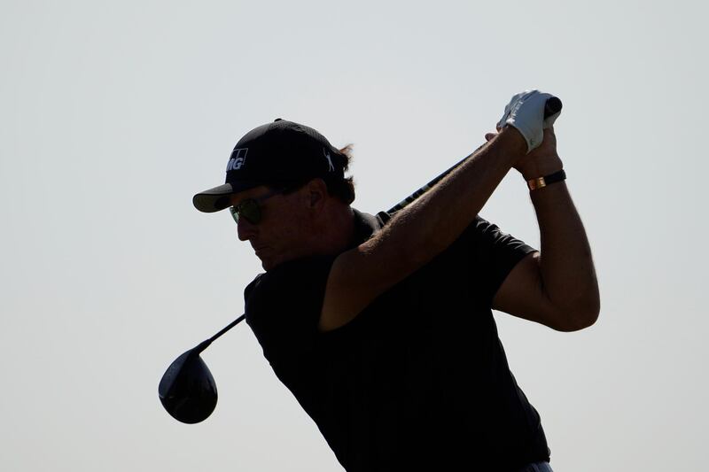 Phil Mickelson takes his tee shot on the 16th. AP