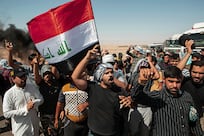 Protesters in southern Iraq dispersed by baton-wielding riot police