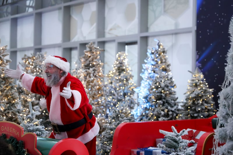 Santa Claus in the holiday spirit at The Galleria Mall Al Maryah Island. Khushnum Bhandari / The National
