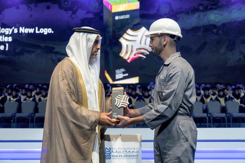 ABU DHABI, UNITED ARAB EMIRATES - October 07, 2018: HH Sheikh Hamed bin Zayed Al Nahyan, Chairman of the Crown Prince Court of Abu Dhabi and Abu Dhabi Executive Council Member (L), presents a certificate to a student during the 2018 Khalifa University Graduation ceremony at the Abu Dhabi National Exhibition Centre (ADNEC).

( Rashed Al Mansoori / Crown Prince Court - Abu Dhabi )
---