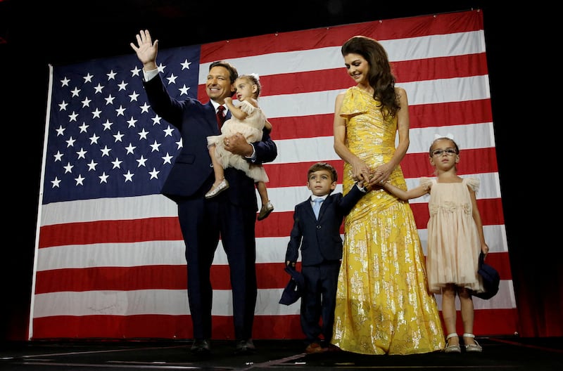 Florida's Republican Governor Ron DeSantis waves from the stage next to his wife Casey and children during his midterm elections party in Tampa. Reuters