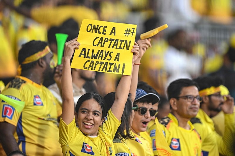 Chennai Super Kings' fans cheer before the start of the Indian Premier League match between Chennai Super Kings and Royal Challengers Bangalore. AFP