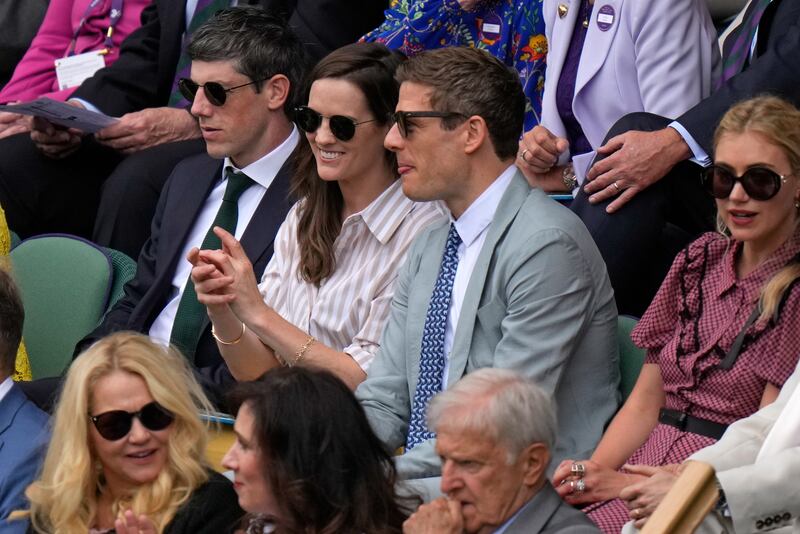 Actor James Norton, second right, and actor Imogen Poots, right, sit in the Royal Box. AP