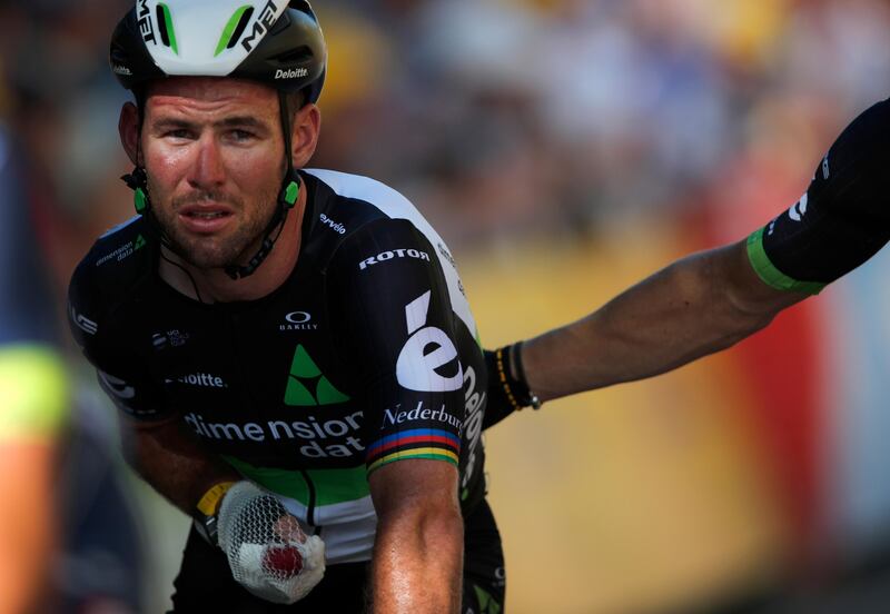 Britain's Mark Cavendish crosses the finish line after he crashed during the sprint of the fourth stage of the Tour de France on Tuesday. Christophe Ena / AP Photo