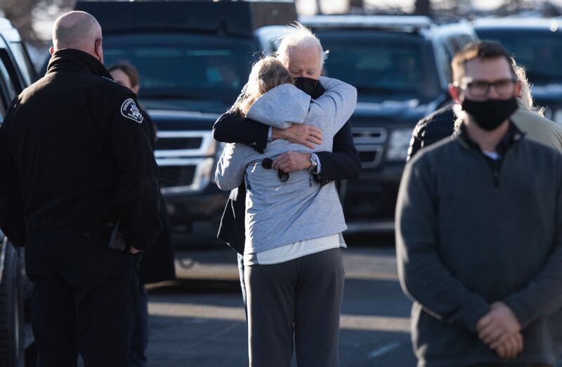 US President Joe Biden hugs a victim of the Marshall Fire as he tours a destroyed neighbourhood in Louisville, Colorado.  AFP