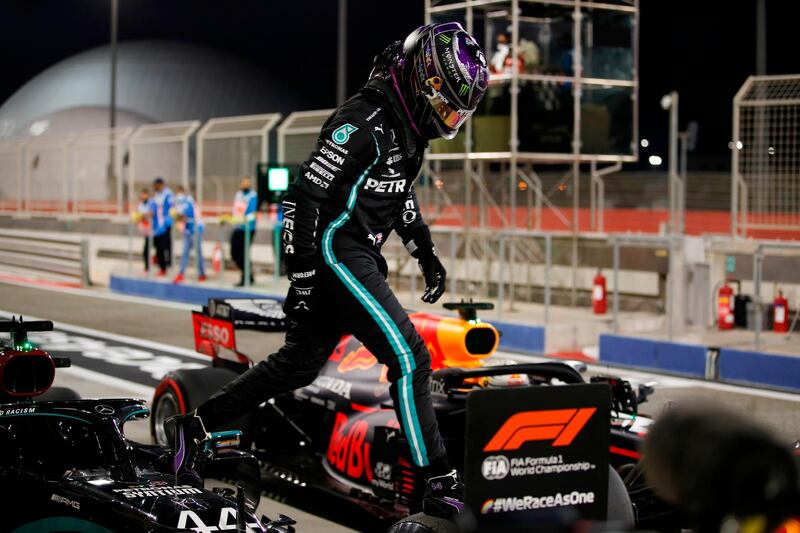 Mercedes' British driver Lewis Hamilton steps out of his car after the qualifying session on the eve of the Bahrain Formula One Grand Prix at the Bahrain International Circuit in the city of Sakhir on November 28, 2020. / AFP / POOL / HAMAD I MOHAMMED
