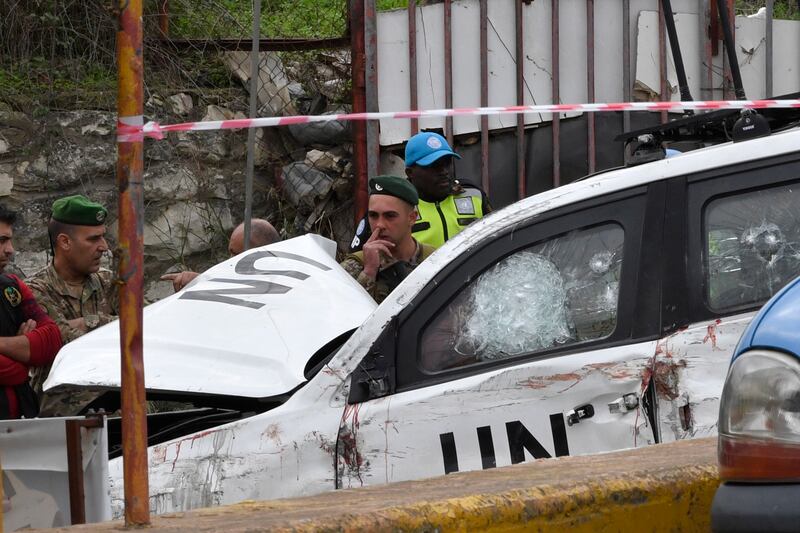 Lebanese soldiers and UN peacekeepers at the attack site in south Lebanon. EPA