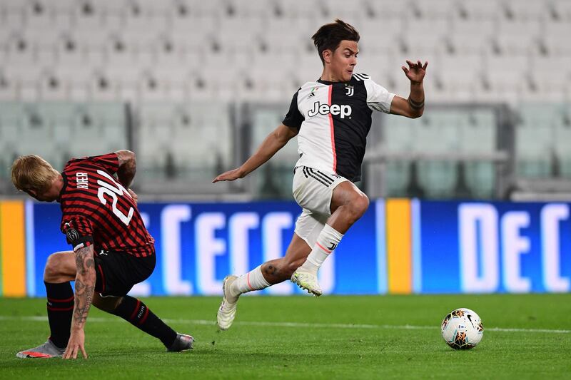 Juventus forward Paulo Dybala outruns AC Milan's Danish defender Simon Kjaer. AFP