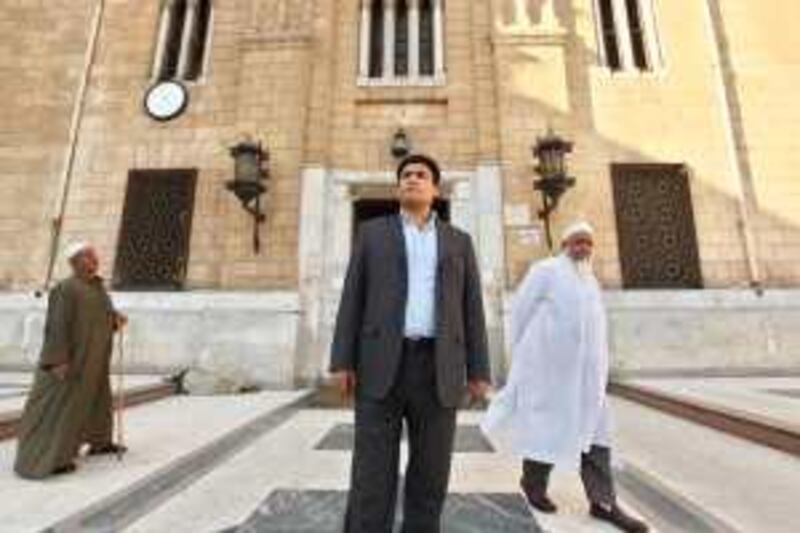 Shia Muslim Mahmoud Gaber, 38, poses for a photo in front of the El Hussein Mosque in Cairo, Egypt, May 5, 2009. Victoria Hazou *** Local Caption ***  VH_ShiaEgypt (11).JPG