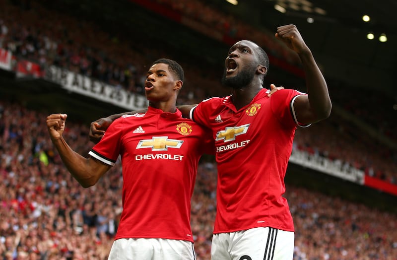 Manchester United's Romelu Lukaku, right, celebrates with Manchester United's Marcus Rashford after scoring his side's first goal of the game during the English Premier League soccer match between Manchester United and West Ham United at Old Trafford in Manchester, England, Sunday, Aug. 13, 2017. (AP Photo/Dave Thompson)
