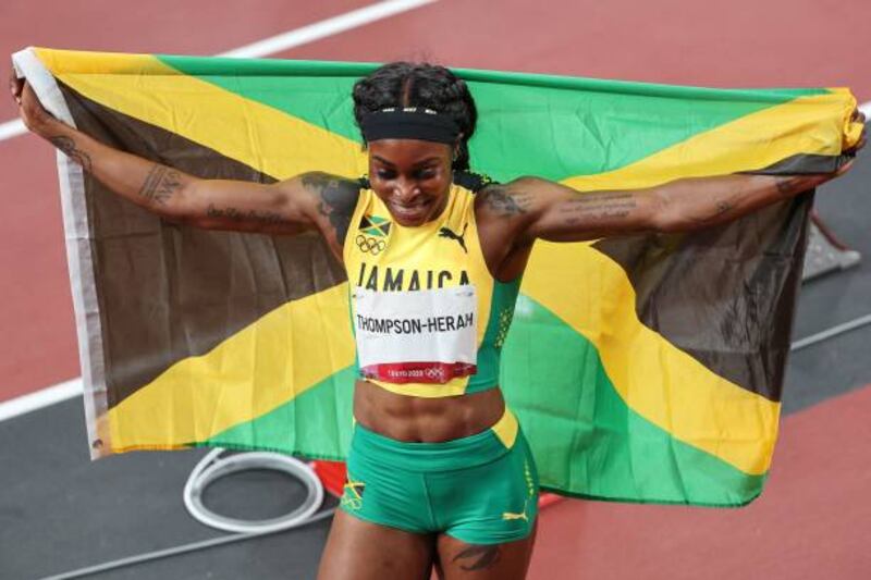 Jamaica's Elaine Thompson-Herah celebrates taking gold in the women's 200m final.