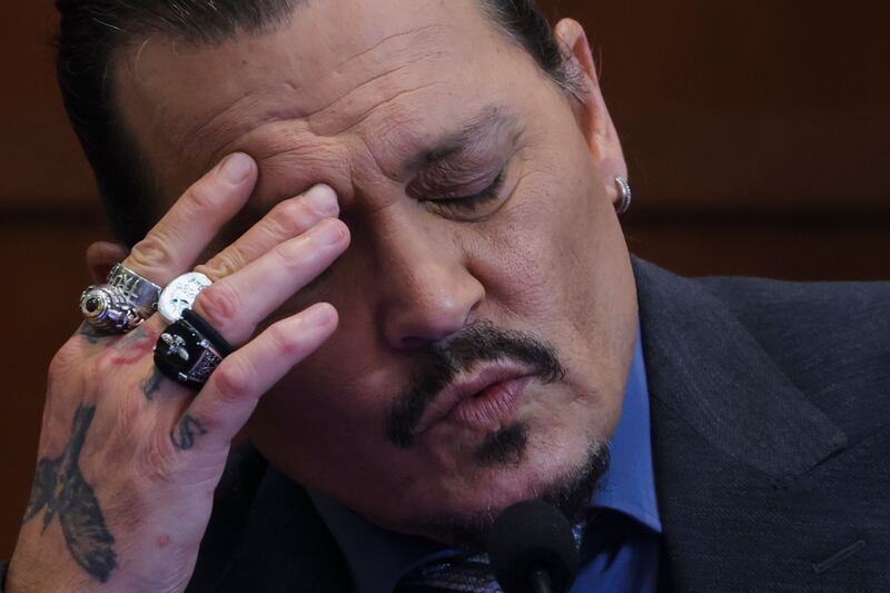 Depp reacts as he gives evidence in the courtroom.  AFP