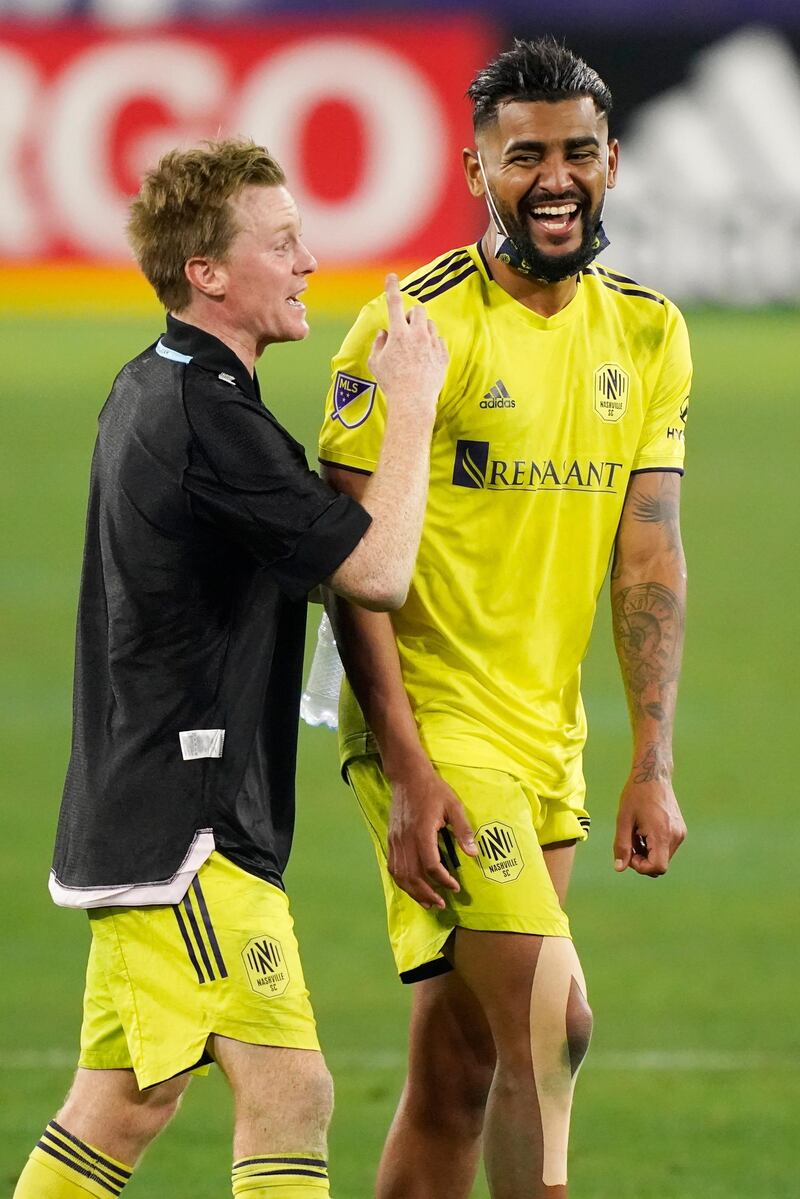 Nashville midfielders Dax McCarty, left, and Anibal Godoy leave the pitch. AP